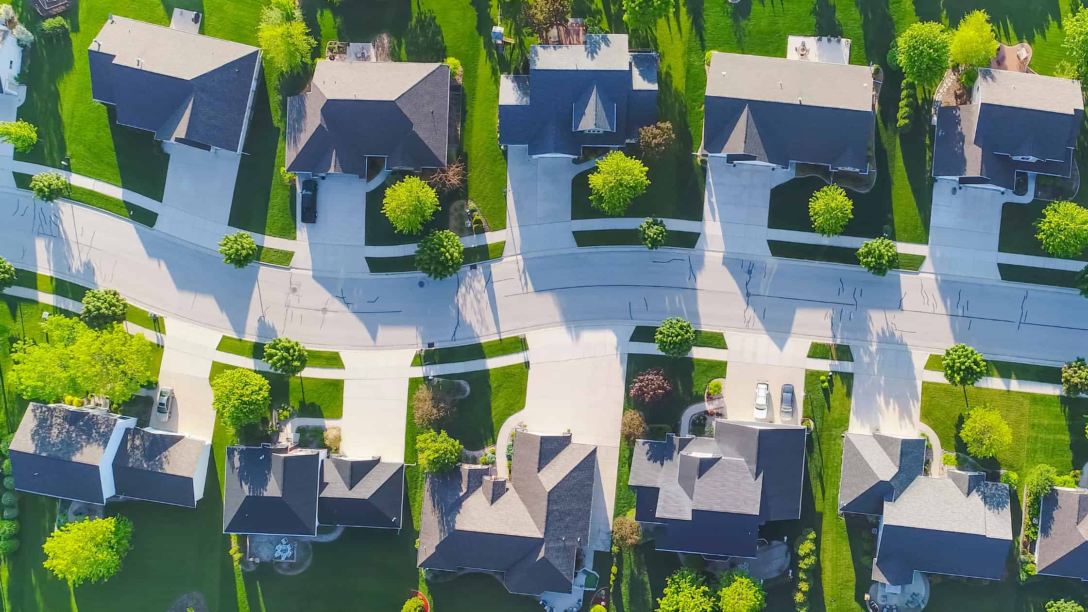 Aerial view of an HOA community. Learn how self-managed HOA software can help your community transform its operations and save money.
