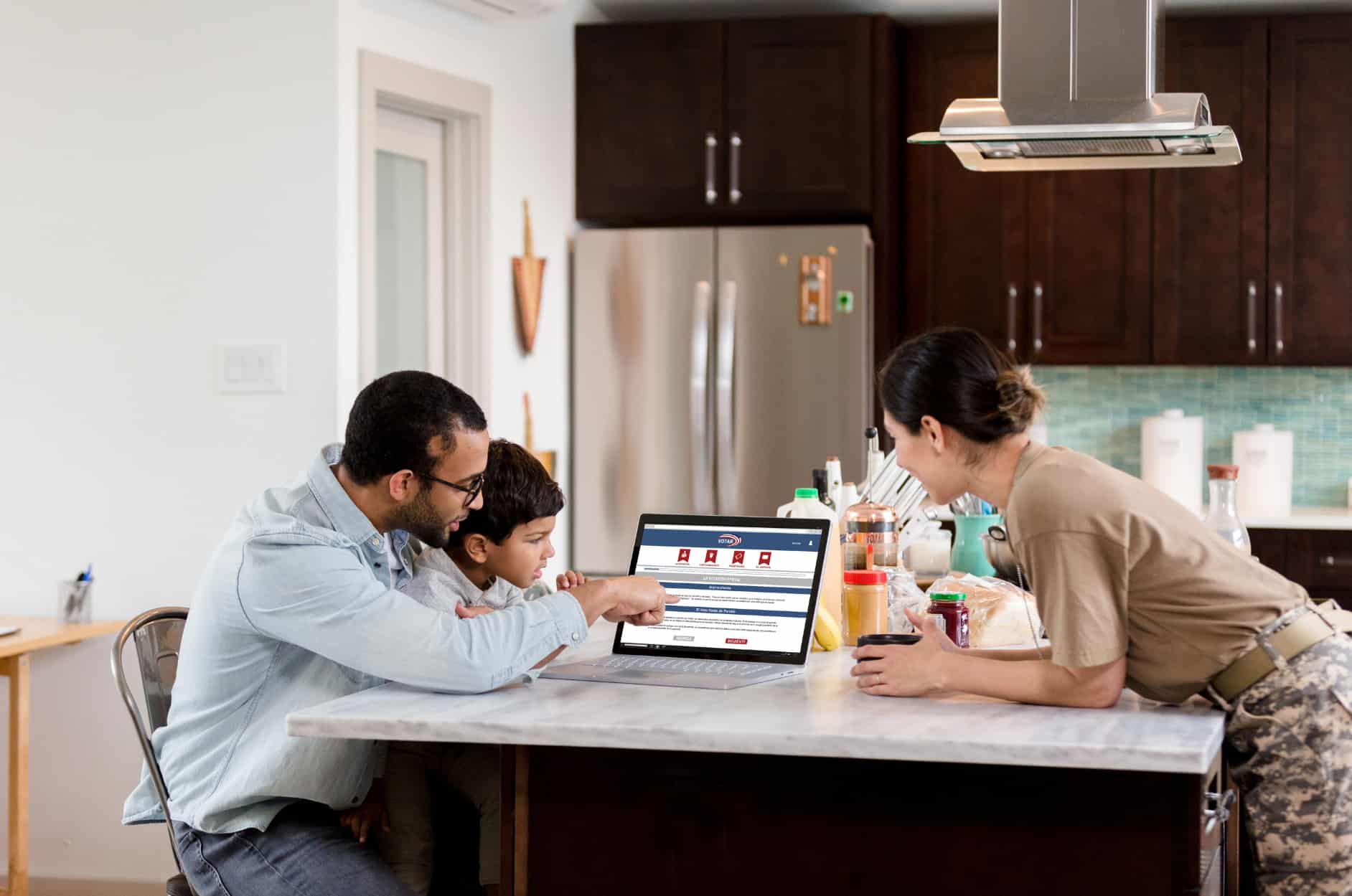 Image of Family at a Table With Laptop Voting